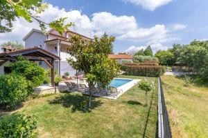 an image of a house with a swimming pool at Modern Villa Vesna with Private Pool in Jakići
