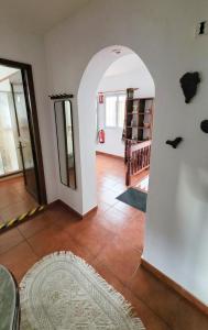 a living room with an archway in a house at Casa Gustavo Apartman in La Guancha