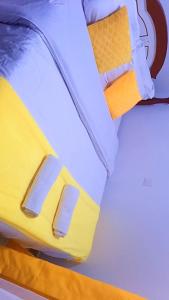 a close up of the foot of a bed at Classic in Narok +2 photos