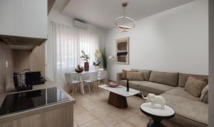 a living room with a couch and a table at Ierapetra’s Mosque House in Ierapetra