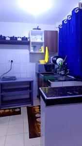 a kitchen with blue cabinets and a kitchen sink at Classic in Narok