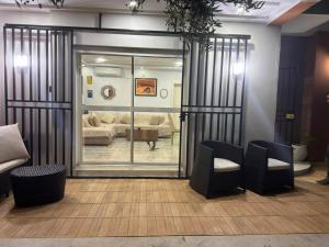 a room with a glass door with a living room at Dar Julia in Sousse