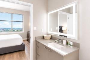 a bathroom with a sink and a large window at Luxury Apartment In Harbor Point in Stamford
