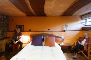 a man and woman sitting on a bed in a room at Apart Domus in San Javier +18 photos
