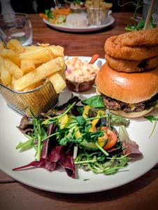 a plate of food with a sandwich and french fries at The Wigtown Ploughman in Wigtown