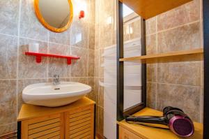 a bathroom with a sink and a mirror at La gentilhommière in Villemorien +23 photos