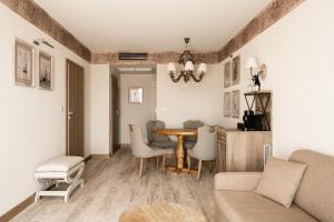 a living room with a table and chairs at Aries Lago Park Hotel & SPA, Mazury in Olsztynek +93 photos