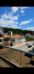 a view of a parking lot from a balcony at CIty view apartment in Gotse Delchev