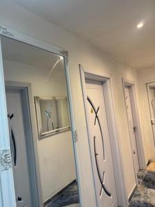 a mirror in a room with three doors at Arolen in Nesebar +19 photos