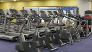a gym with rows of treadmills at Mullingar Park Hotel in Mullingar