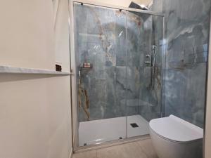 a bathroom with a shower and a toilet at Sicilia Mount&Sea in Mascali +61 photos