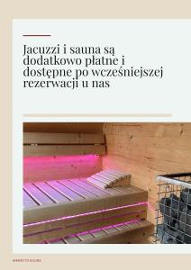 a picture of a wooden bunk bed with pink lighting at Amaretto Apartamenty Solina centrum in Solina +99 photos