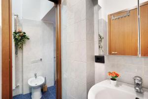 a bathroom with a sink and a toilet and a shower at Varazze Mare in Varazze +27 photos