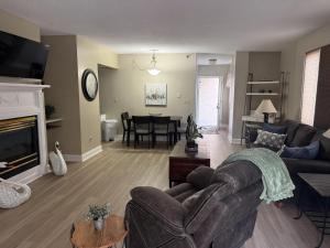 a living room with a couch and a table at River Place Condos #401 2BD in Pigeon Forge