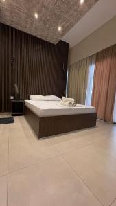 a bedroom with a large bed in a room at Hotel Epavli in Nea Kallikrateia +96 photos