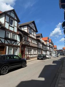 a street with cars parked in front of buildings at Altstadtnest mit großem Garten in Bad Sooden-Allendorf