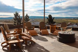 a group of chairs and tables on a patio at Elite Hotel Frost - Hotel & Spa in Kiruna
