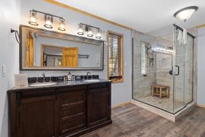 a bathroom with a sink and a shower at Tatanka Hideaway Hot Tub Pool Table Massive Space in Custer +45 photos