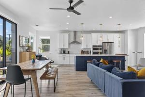 a kitchen and living room with a blue couch and a table at Chardonnay Getaway in Glen Ellen