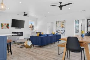 a living room with a blue couch and a table at Chardonnay Getaway in Glen Ellen +32 photos
