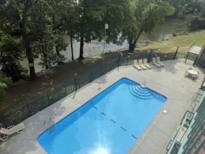 an overhead view of a large blue swimming pool at River Place Condos #401 2BD in Pigeon Forge