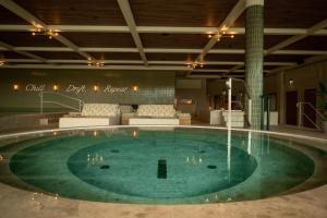 a pool in a hotel room with a swimming pool at The Dock in Södertälje