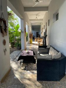 a living room with a couch and a table at Ch Loreto Hotel Boutique in Ciudad de Loreto