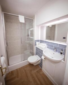 a bathroom with a toilet and a sink and a shower at JA The Bruntsfield - Edinburgh in Edinburgh
