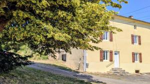 an old building with a tree in front of it at Gîte de roger in Blond +7 photos
