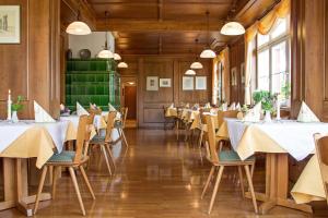 a dining room with white tables and chairs at Gasthaus Kreuz in Ühlingen-Birkendorf
