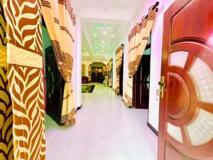 a hallway with doors and curtains in a building at Cleopatra villa in Kattankudi