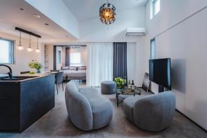 a large living room with a kitchen and a living room at SLL Urban Suites Ebisu in Tokyo