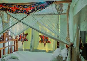 a bedroom with a bed with stars on the wall at King Solomon Hotel in Nkunjila