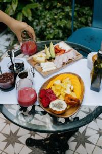 a glass table with a plate of food on it at Fausto by Andean in Lima