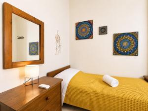 a bedroom with two beds and a mirror and a dresser at Sun Arise in Porto Rafti +30 photos