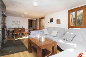 a living room with a couch and a table at Casa El Mirador de Jaca in Jaca