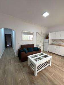 a living room with a couch and a table at Teror Centro 1 in Teror