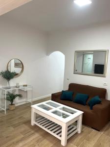 a living room with a couch and a table at Teror Centro 1 in Teror
