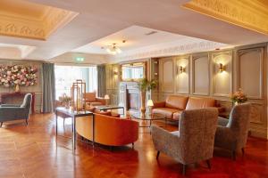 a living room with a couch and chairs at Bunratty Castle Hotel & Leisure Club, BW Premier Collection in Bunratty