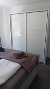 a bed with a towel on it with a window at Kontinental A in Bad Harzburg +33 photos