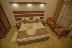 Voodi või voodid majutusasutuse Avenra Beach Hikkaduwa toas