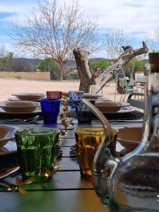 a table with plates and bowls on top of it at El Refugio de Hugo in Caravaca de la Cruz