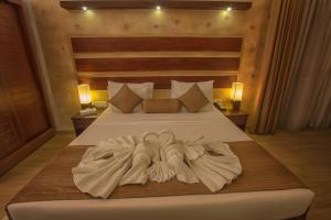 Voodi või voodid majutusasutuse Avenra Beach Hikkaduwa toas