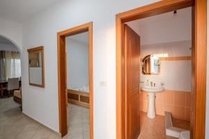 a bathroom with a sink and a mirror at Cloud Nine Retreat, Ksamil in Ksamil +40 photos