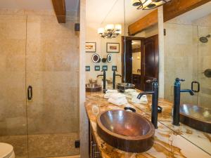 a bathroom with two sinks and a shower at Lift One Condominiums - Unit 409 in Aspen