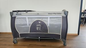 a suitcase on a stand with a signifyify center on it at Feel Home Apartment in Dornbirn