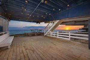 a deck of a cruise ship with the ocean at Malibu Beachfront Home with Rock Spa Ocean Views & Huge Deck in Malibu