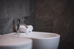 a bathroom with a sink and a faucet at Kessler's Mountain Lodge in Natz-Schabs +73 photos