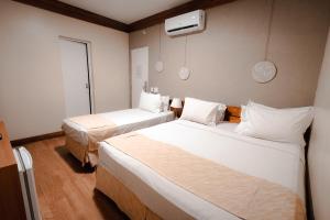 a hotel room with two beds and a window at Carppa Hotel in Fortaleza +35 photos