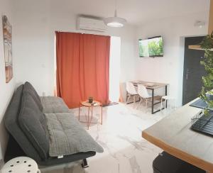 a living room with a couch and a table at Apartments Spasoje 2 in Kotor